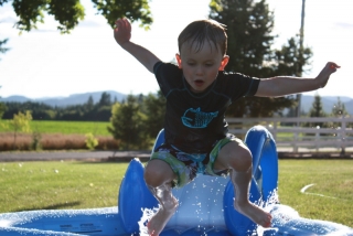 Ethan jumping into Grandma and Grandpa's pool.