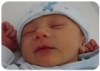 Little guy sleeping his first week.