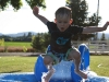 Ethan jumping into Grandma and Grandpa's pool.